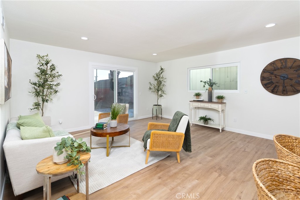 3306 Debbie Lane Riverside, CA 92501 - Photo 5 of 32 a living room with furniture and a potted plant
