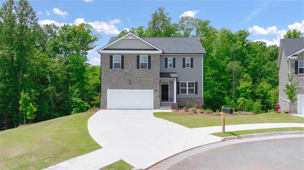 621 Lobelia Way Locust Grove, GA 30248 - Photo 1 of 42 a house that has a tree in front of it