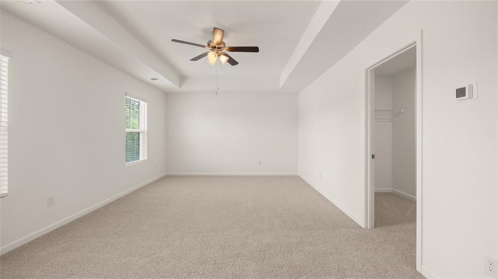 621 Lobelia Way Locust Grove, GA 30248 - Photo 16 of 42 a view of empty room with windows