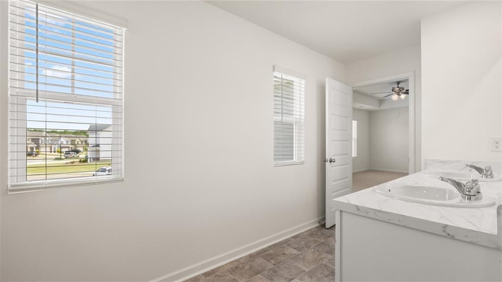 621 Lobelia Way Locust Grove, GA 30248 - Photo 20 of 42 a bathroom with a sink and a mirror
