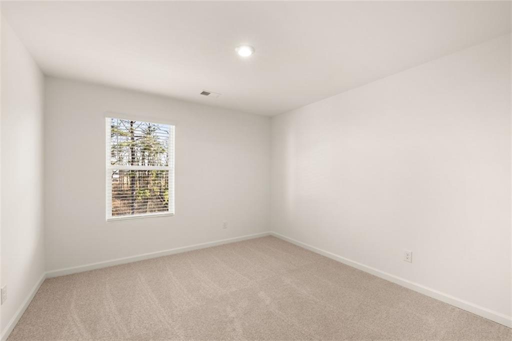 621 Lobelia Way Locust Grove, GA 30248 - Photo 25 of 42 an empty room with a window