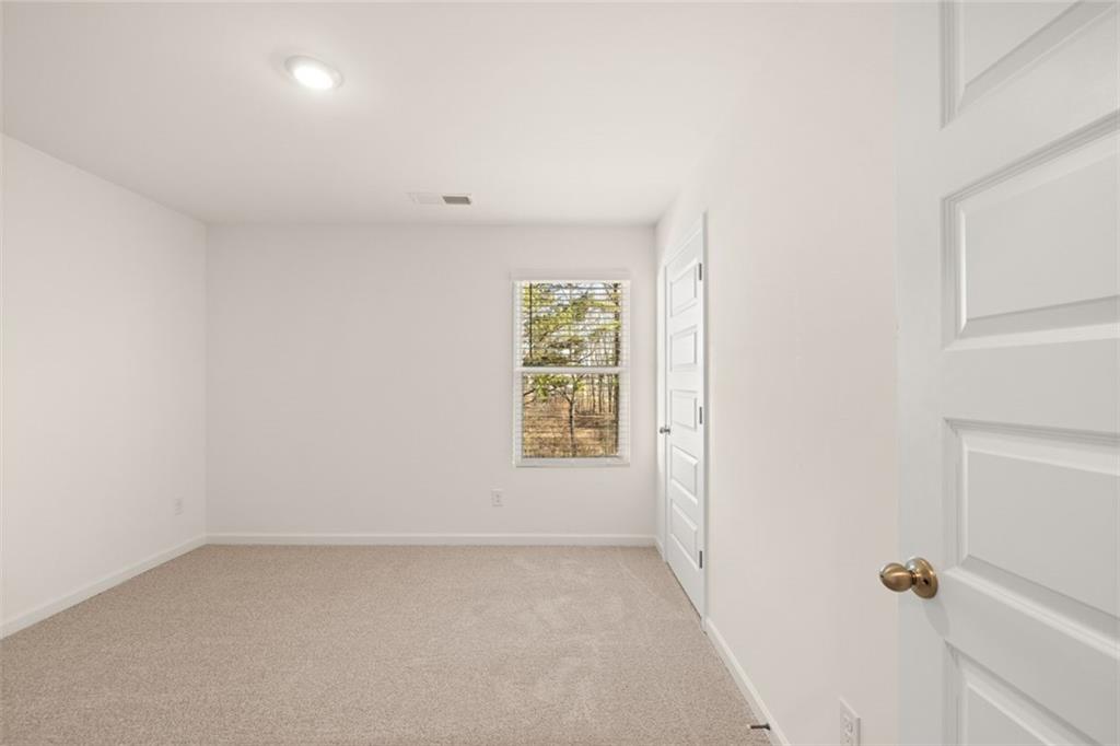 621 Lobelia Way Locust Grove, GA 30248 - Photo 27 of 42 a view of room with window