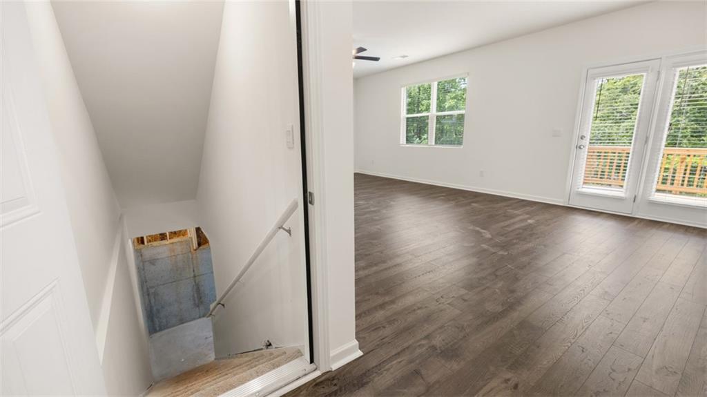 621 Lobelia Way Locust Grove, GA 30248 - Photo 37 of 42 wooden floor in an empty room with a window