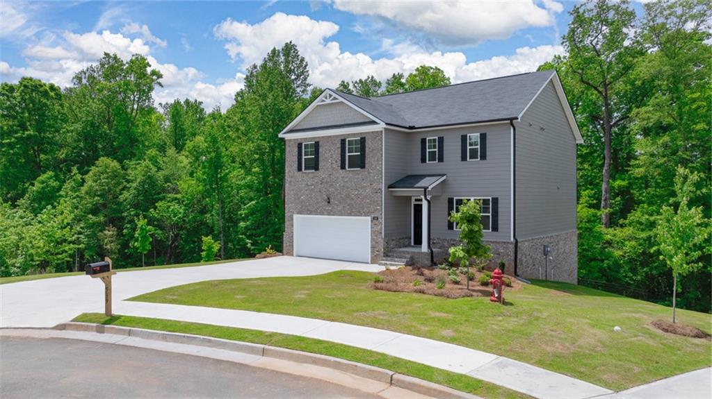 621 Lobelia Way Locust Grove, GA 30248 - Photo 41 of 42 a front view of a house with a yard and porch