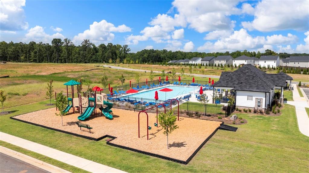 621 Lobelia Way Locust Grove, GA 30248 - Photo 5 of 42 an outdoor space with swimming pool and furniture