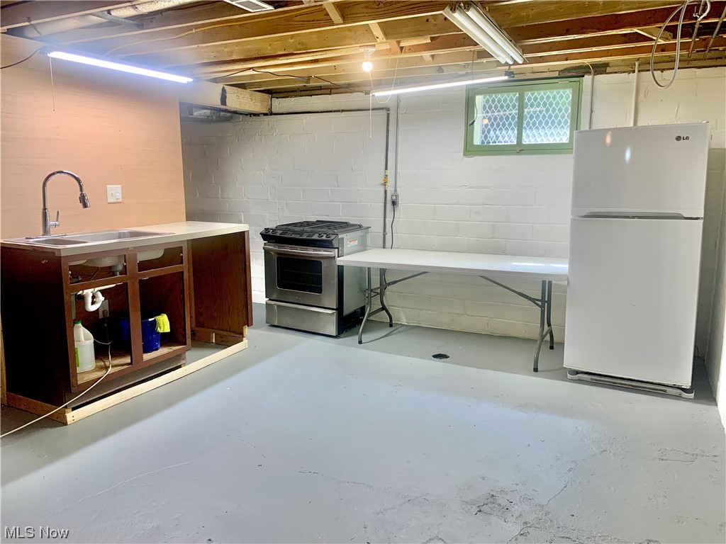 27041 Butternut Ridge Road North Olmsted, OH 44070 - Photo 23 of 28 Basement kitchen area w stove, fridge and sink