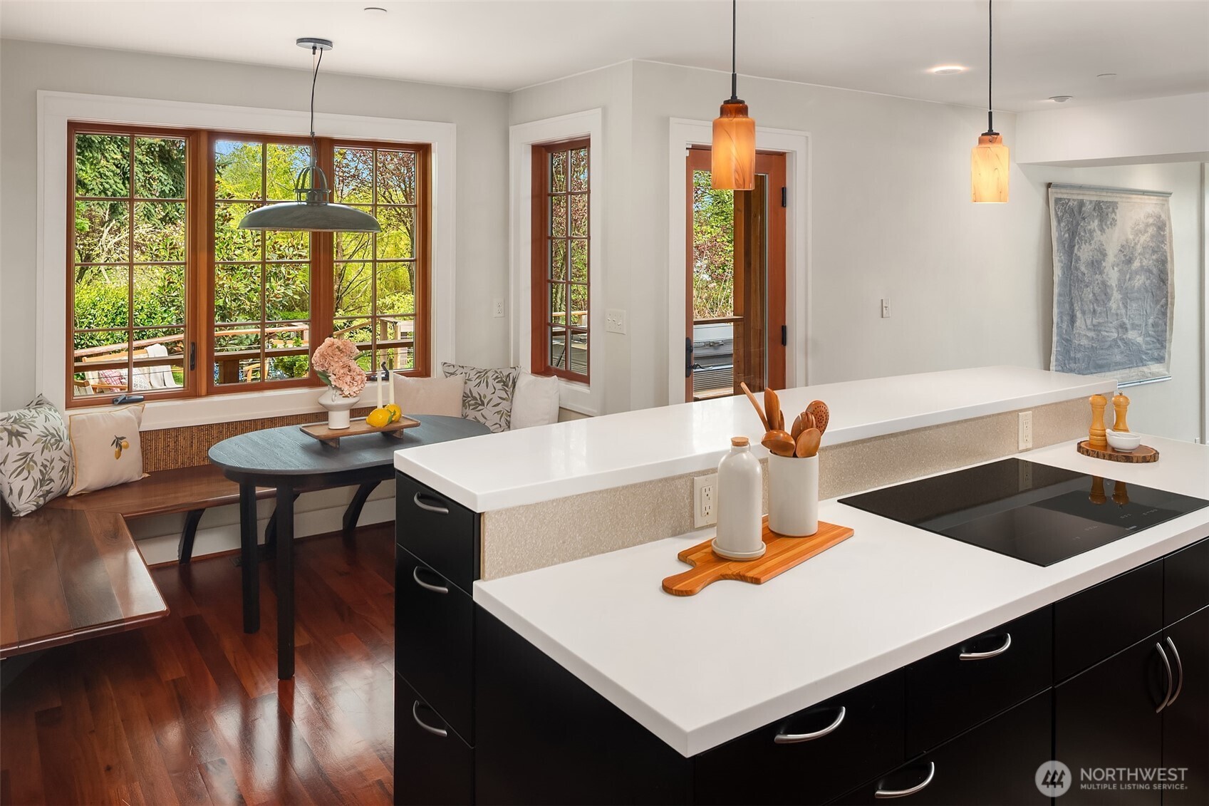 8302 Southwest Dilworth Road Vashon, WA 98070 - Photo 15 of 40 a kitchen with a table chairs and a chandelier