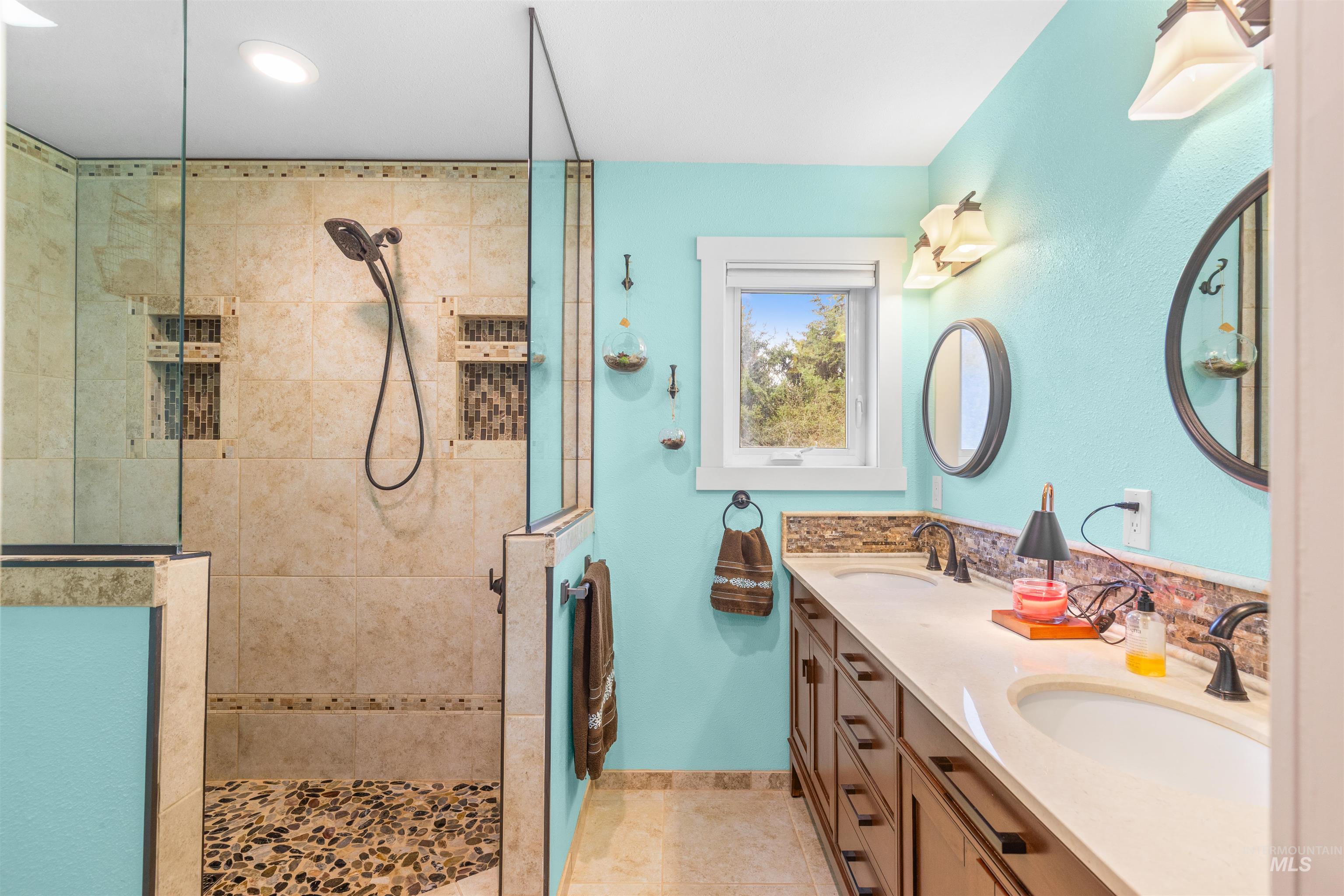 2435 Arborcrest Road Moscow, ID 83843 - Photo 21 of 48 Full bath with double vanity and a tile shower