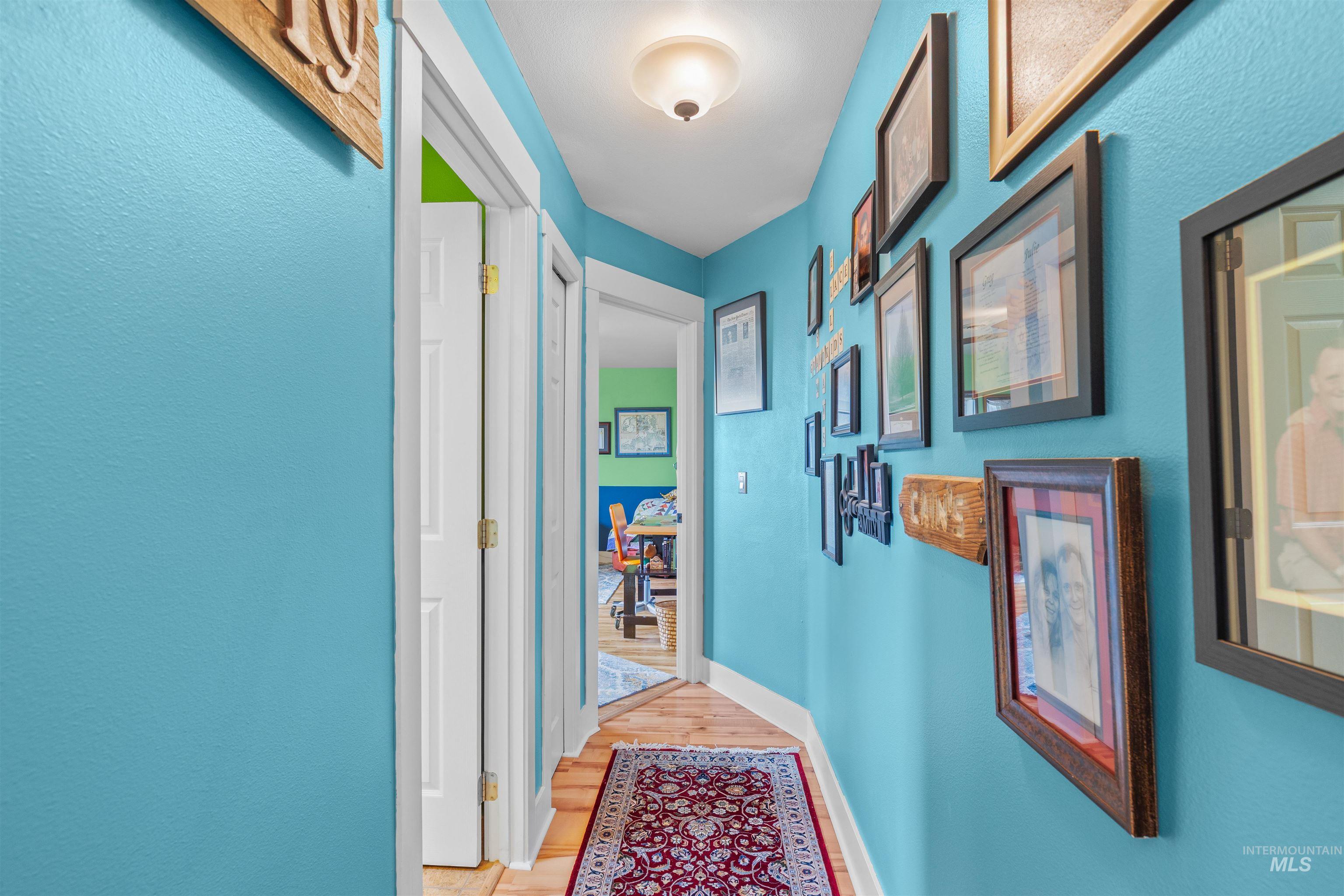 2435 Arborcrest Road Moscow, ID 83843 - Photo 22 of 48 Hallway featuring baseboards and light wood-style flooring