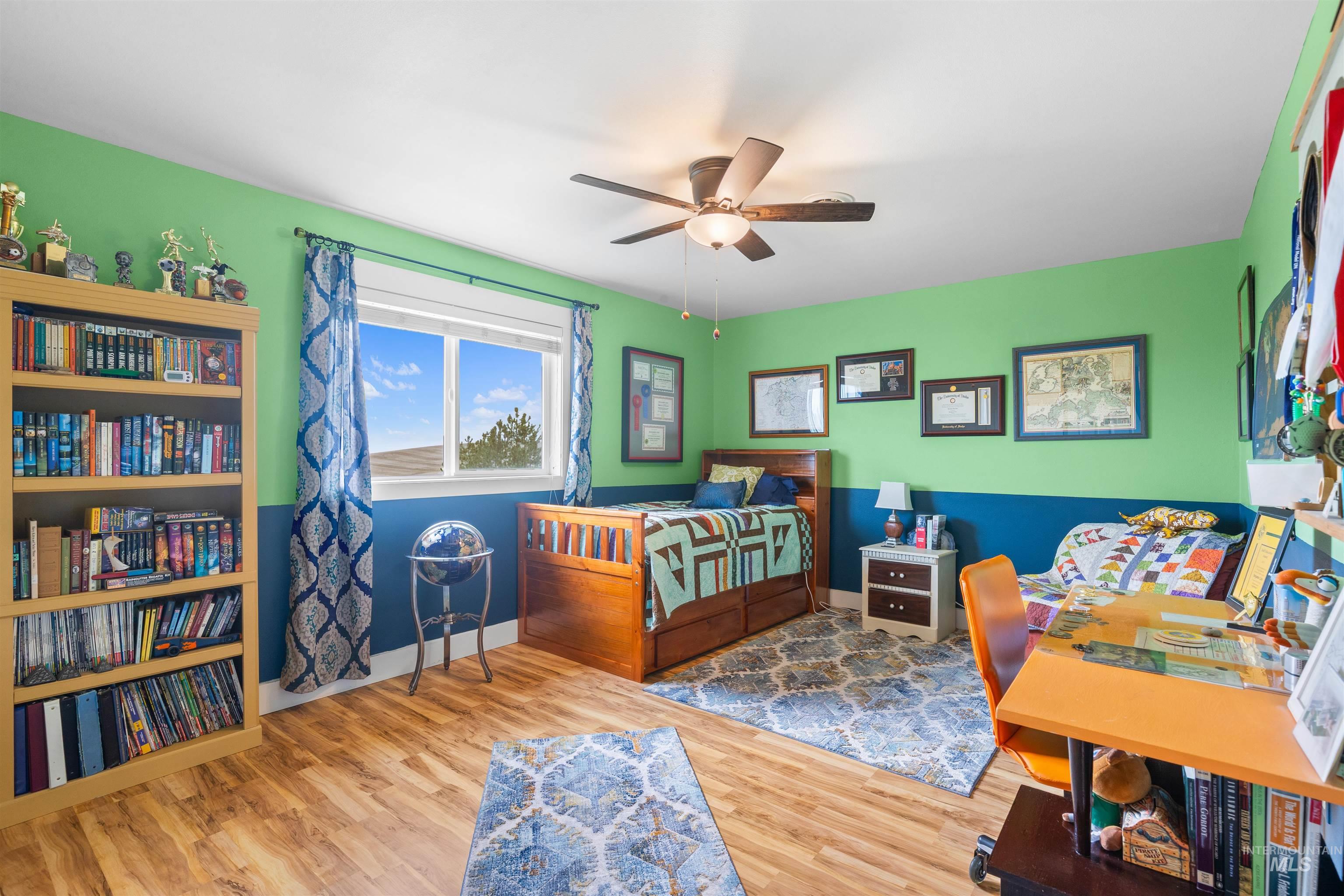 2435 Arborcrest Road Moscow, ID 83843 - Photo 25 of 48 Bedroom featuring wood finished floors and ceiling fan