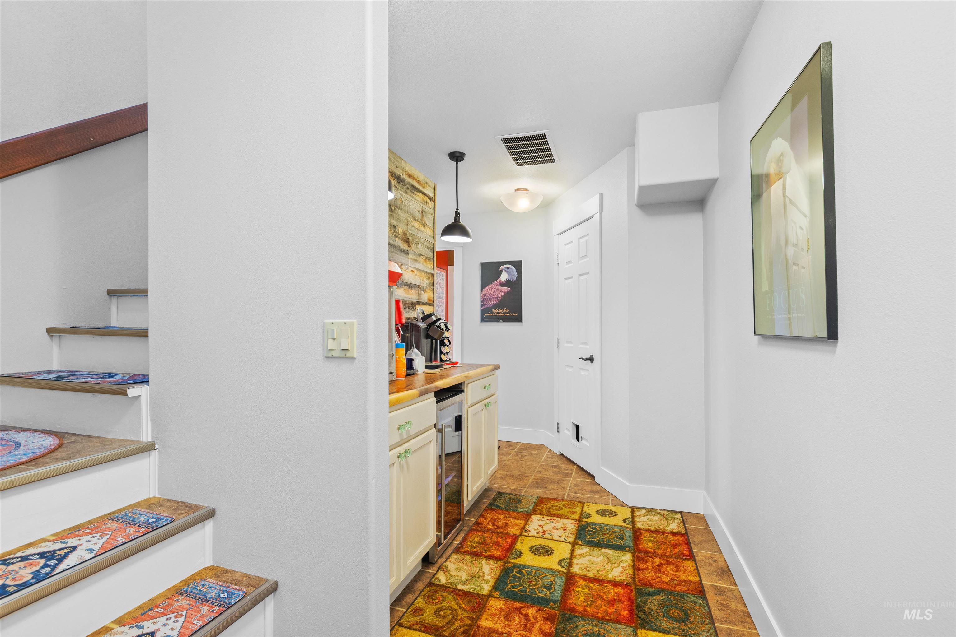 2435 Arborcrest Road Moscow, ID 83843 - Photo 29 of 48 Hallway featuring wine cooler and baseboards