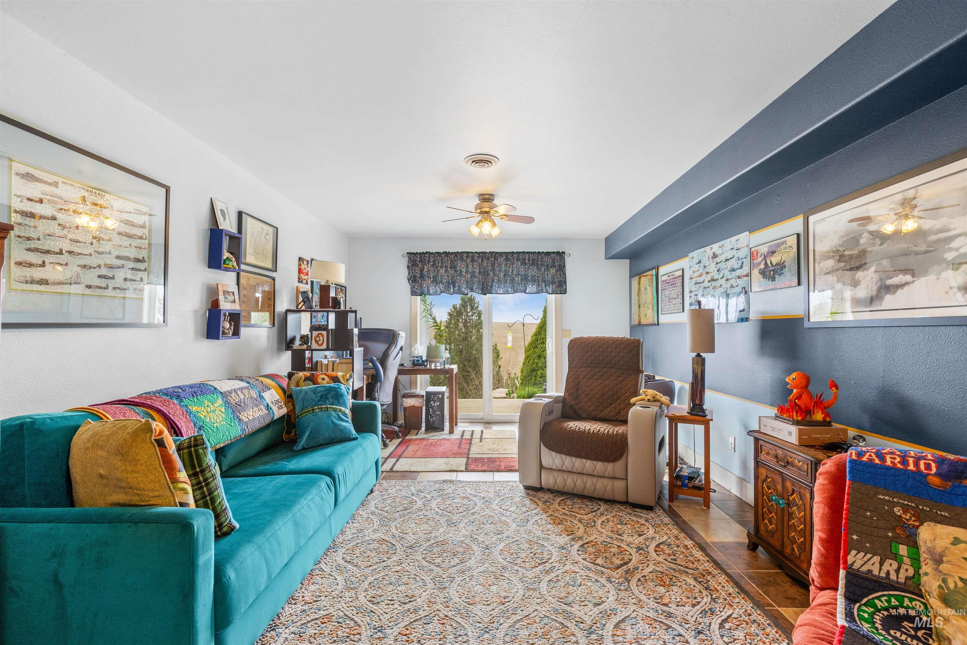 2435 Arborcrest Road Moscow, ID 83843 - Photo 30 of 48 Living room with a ceiling fan