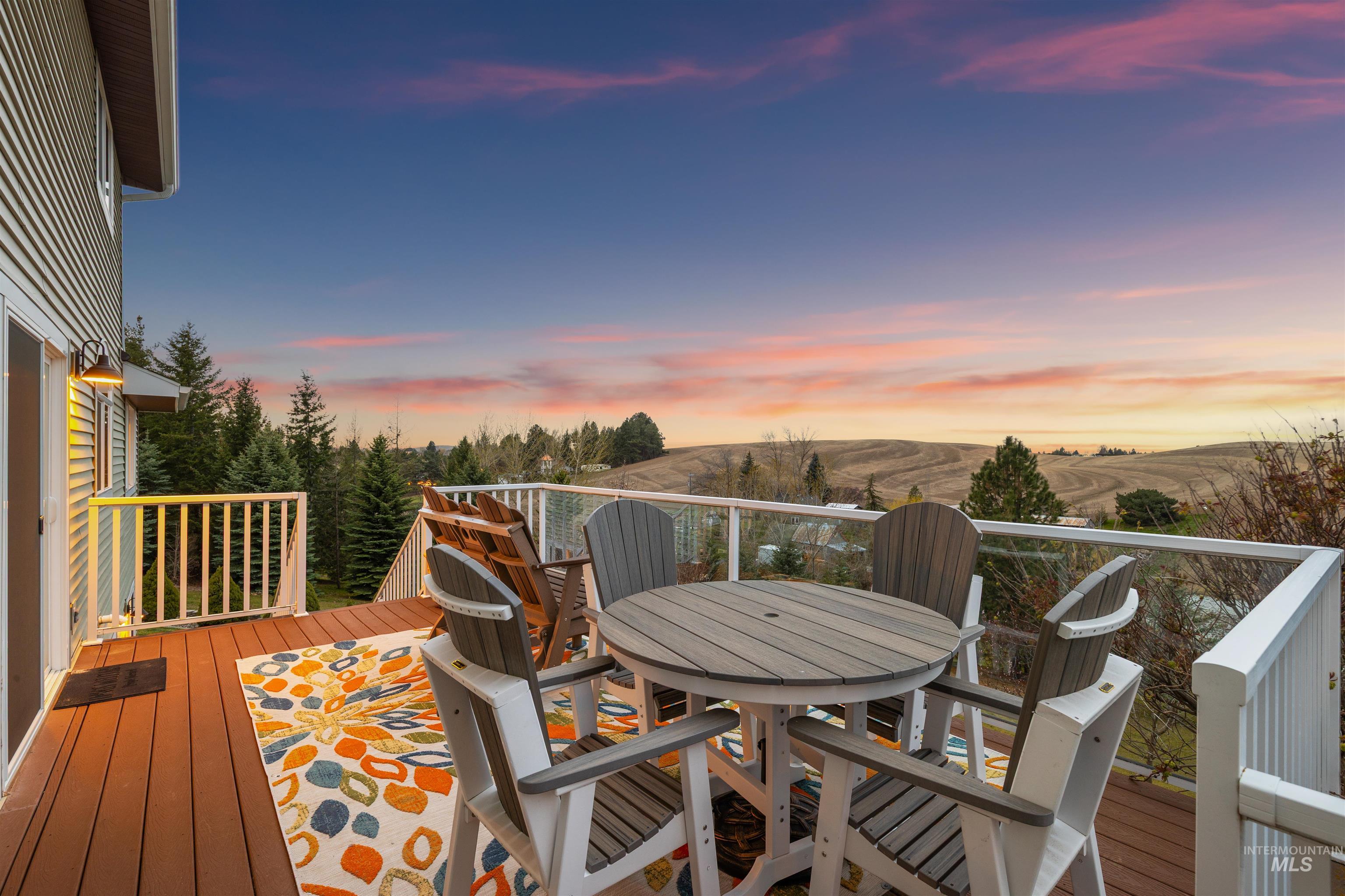 2435 Arborcrest Road Moscow, ID 83843 - Photo 35 of 48 Deck at dusk featuring outdoor dining area