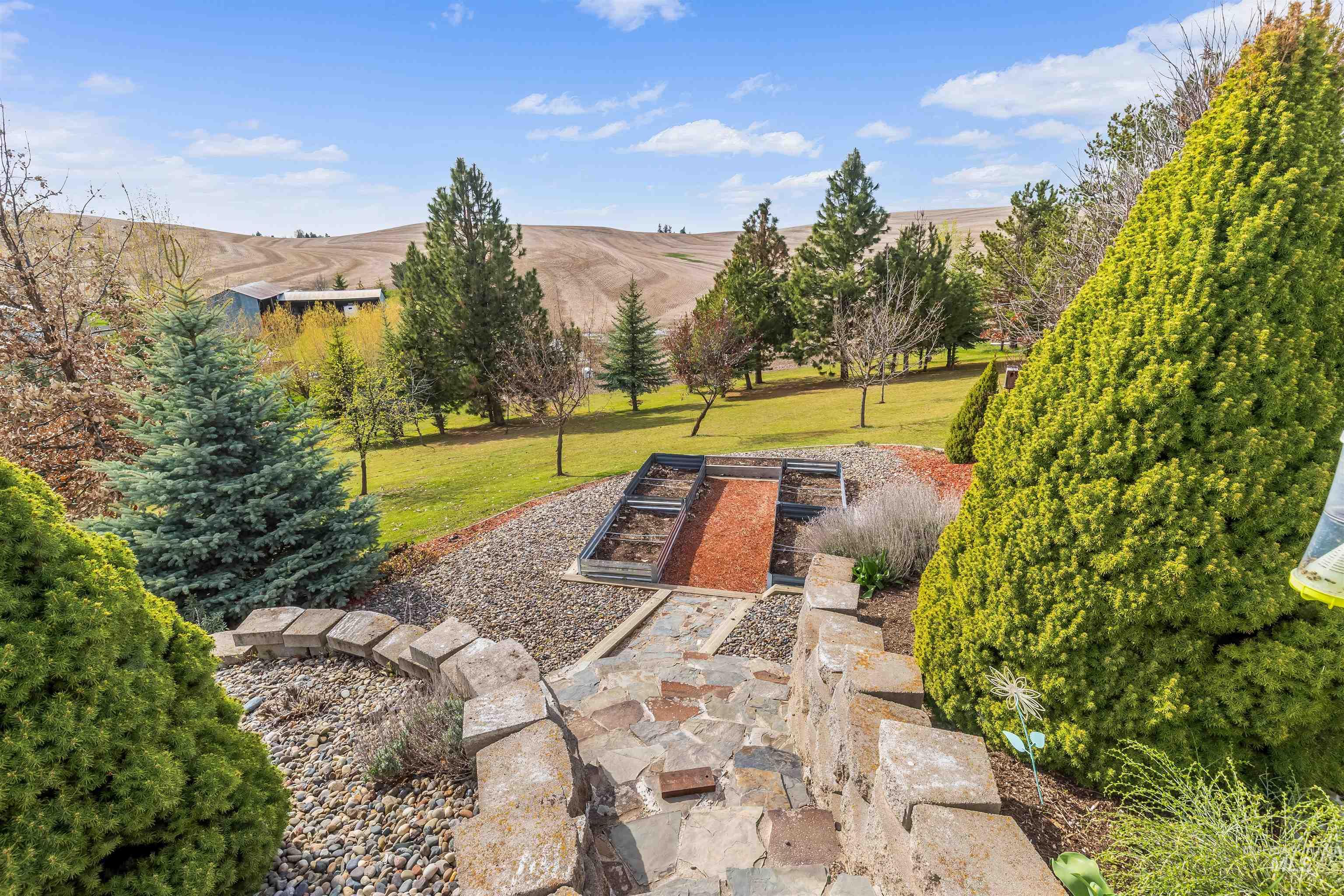 2435 Arborcrest Road Moscow, ID 83843 - Photo 36 of 48 View of patio / terrace with a garden