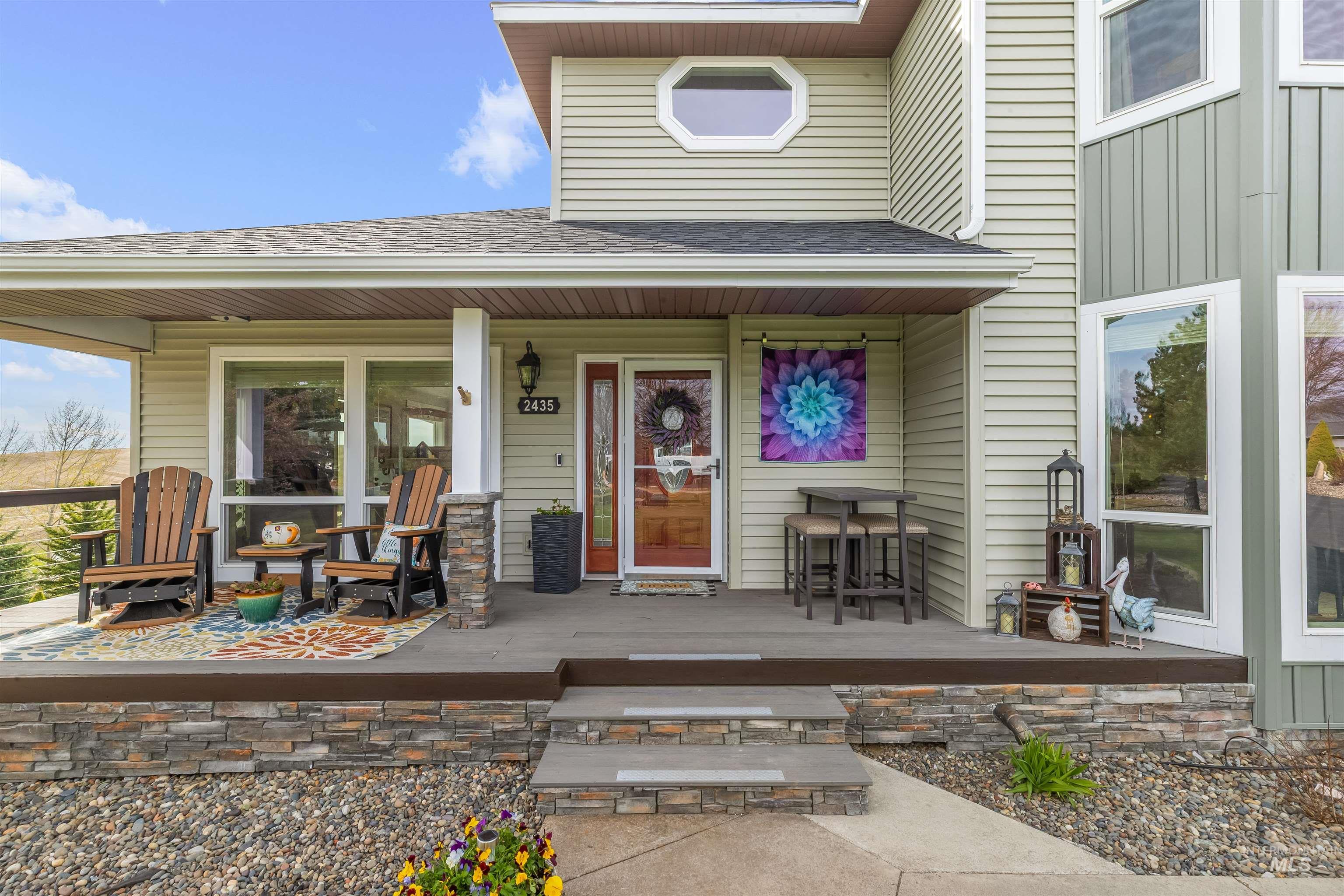 2435 Arborcrest Road Moscow, ID 83843 - Photo 6 of 48 Entrance to property featuring a porch and roof with shingles