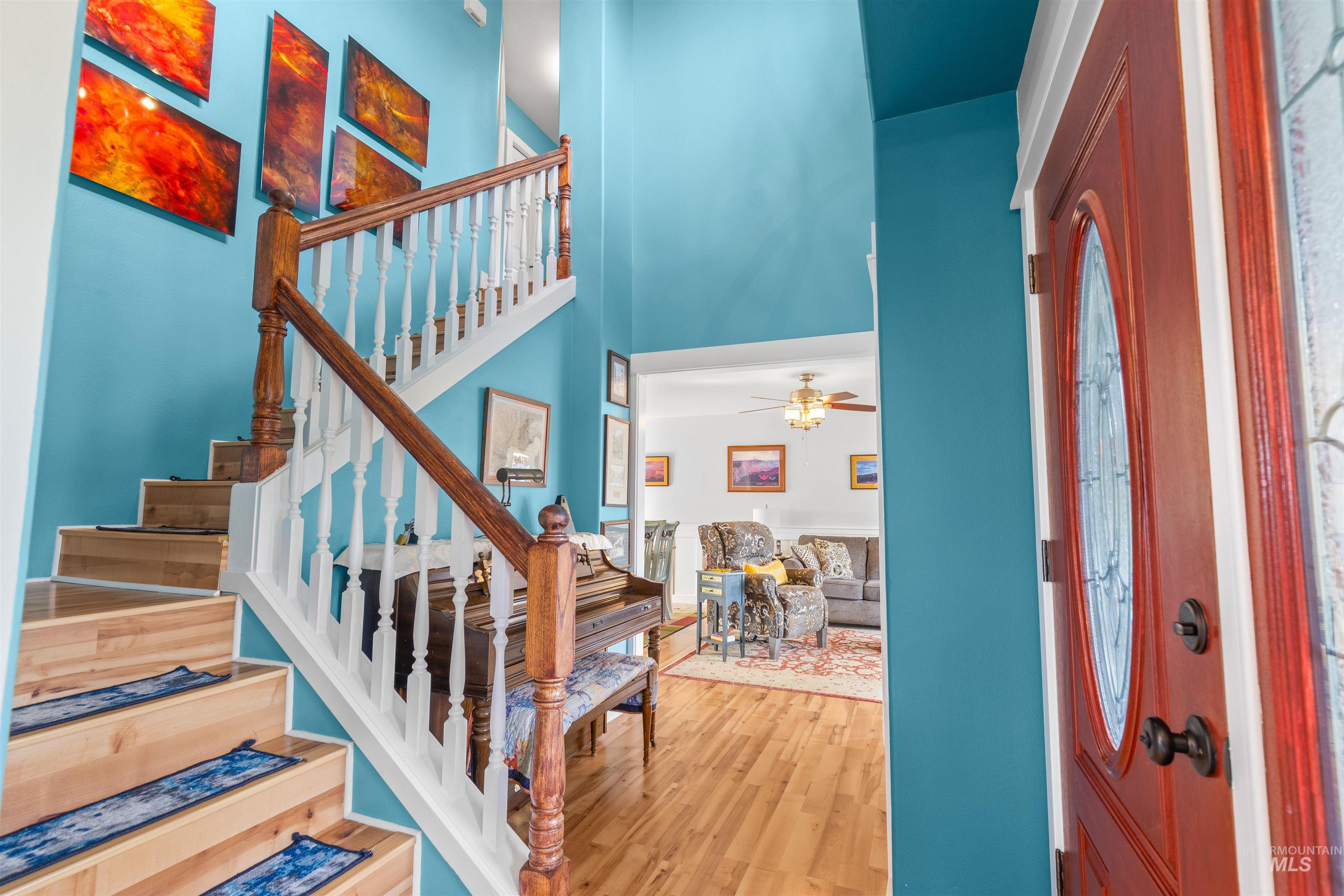 2435 Arborcrest Road Moscow, ID 83843 - Photo 8 of 48 Foyer with light wood-style floors, a high ceiling, and a ceiling fan