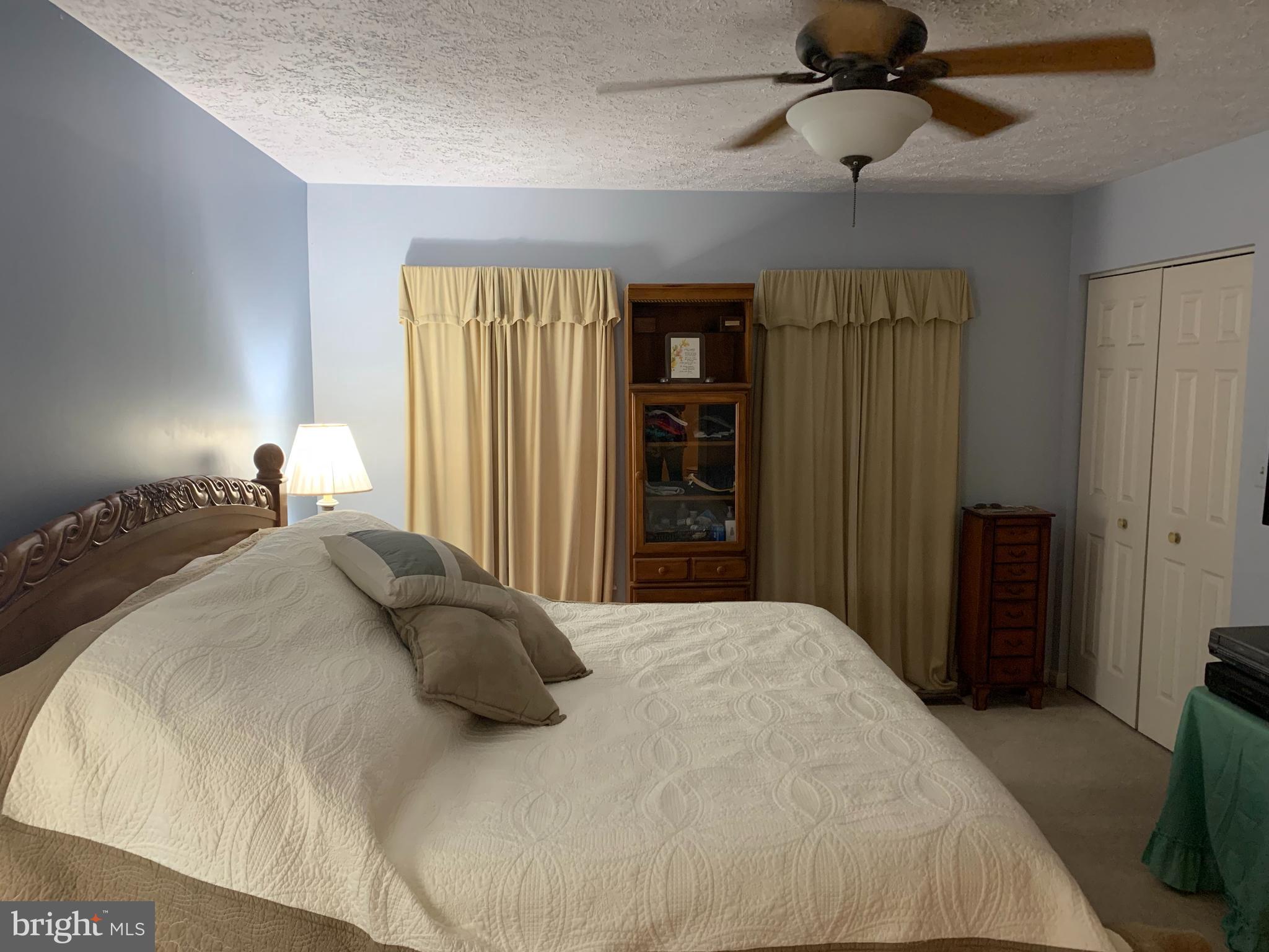 3123 Laurel View Drive Abingdon, MD 21009 - Photo 114 of 135 a bedroom with a bed and a chandelier