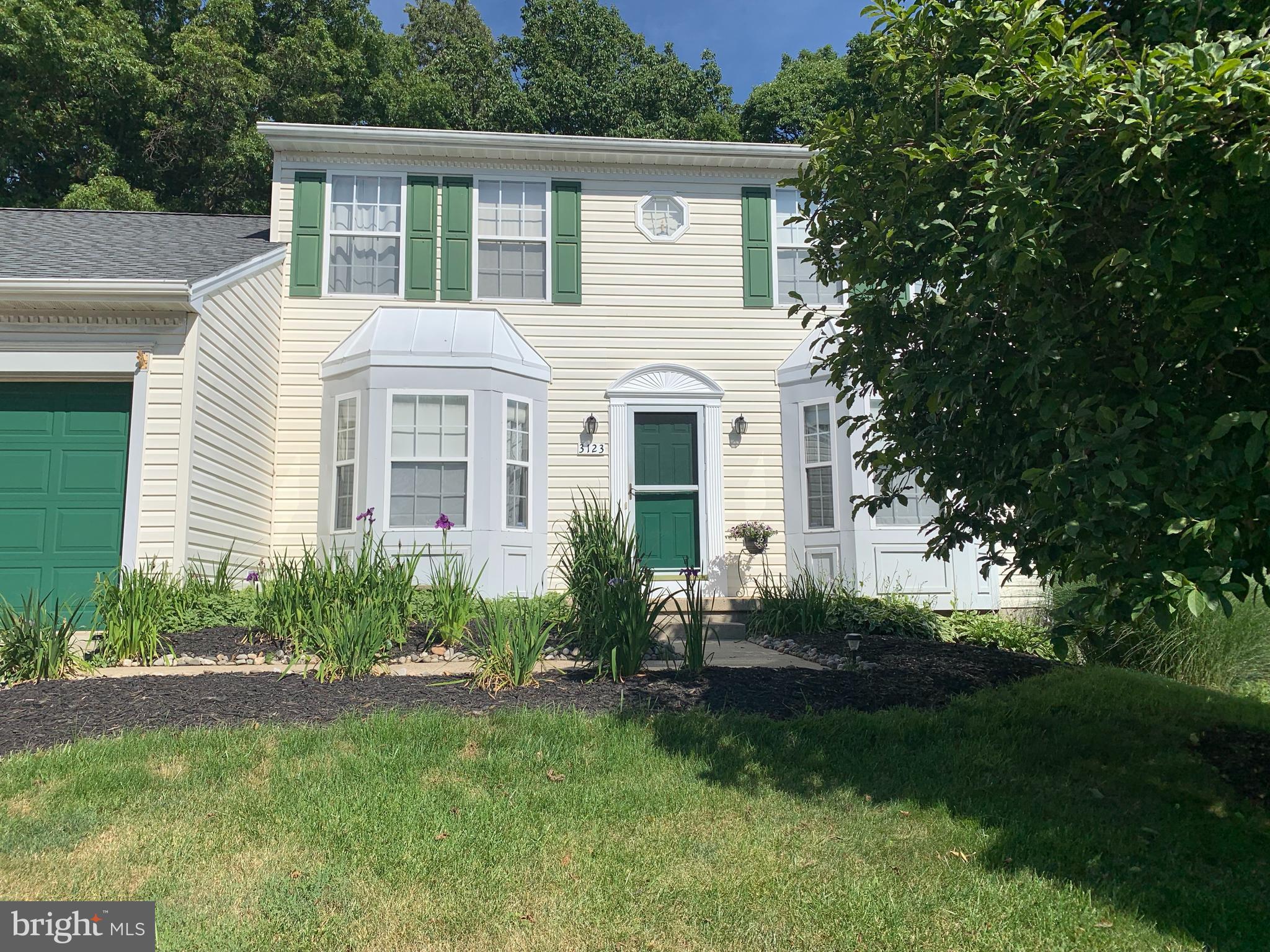 3123 Laurel View Drive Abingdon, MD 21009 - Photo 5 of 135 a front view of a house with a garden and plants