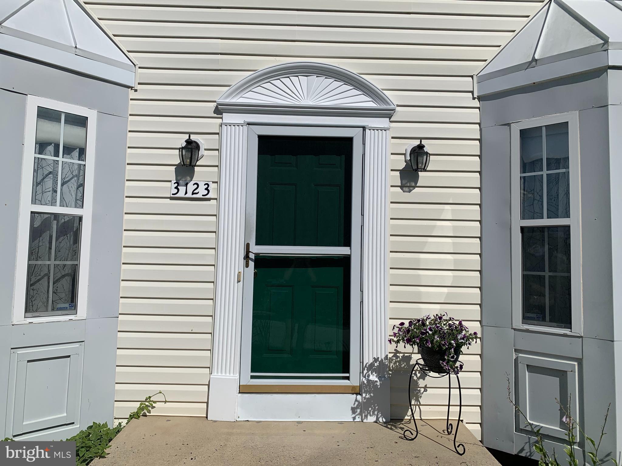 3123 Laurel View Drive Abingdon, MD 21009 - Photo 8 of 135 a front view of a house with a window and potted plants
