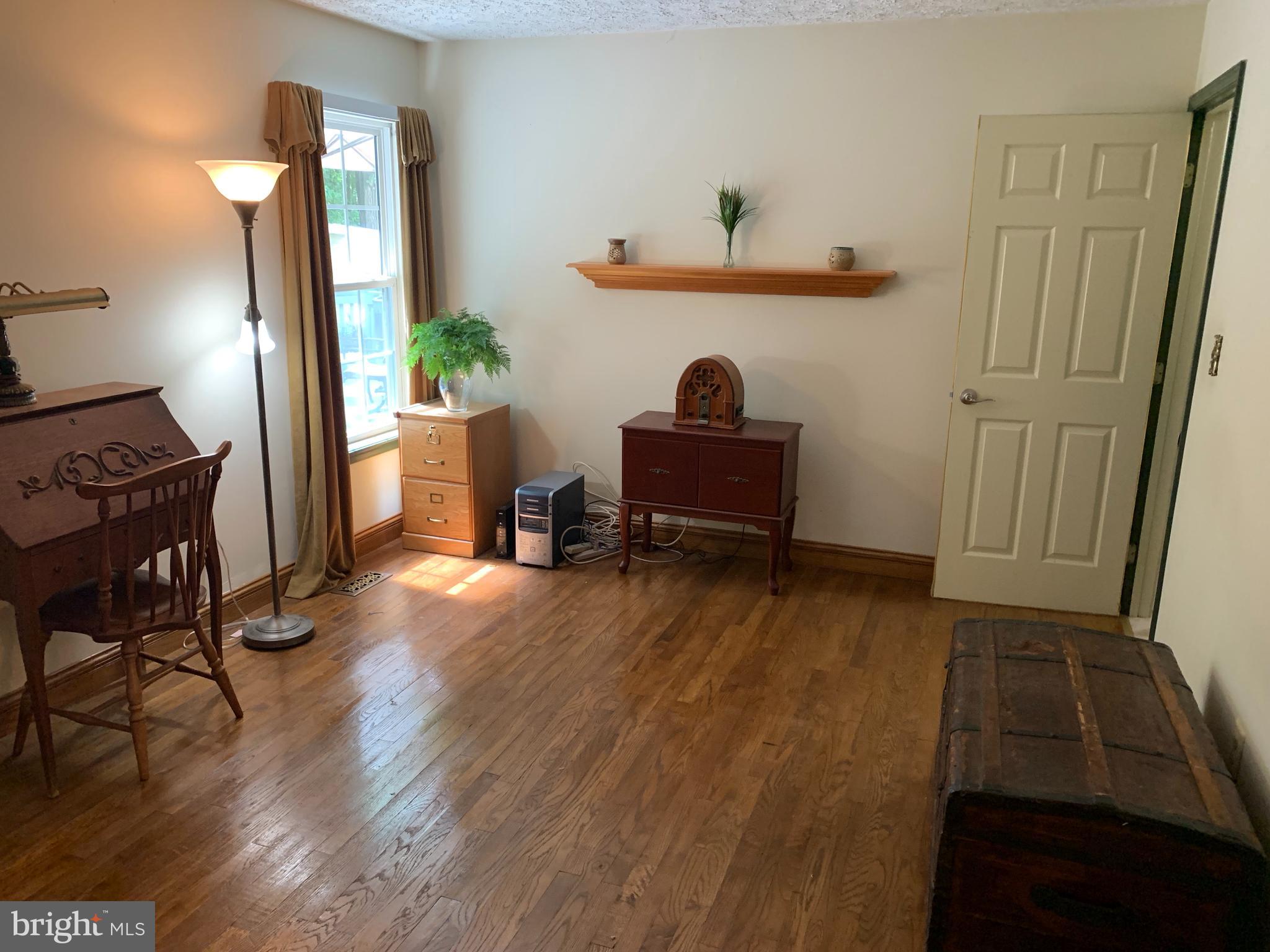 3123 Laurel View Drive Abingdon, MD 21009 - Photo 91 of 135 a living room with furniture and a wooden floor