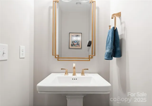 a bathroom with a sink and mirror