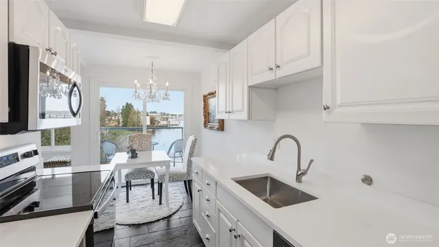 a kitchen with cabinets appliances and a sink