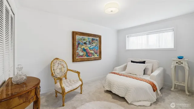 a bathroom with a toilet a sink and a mirror