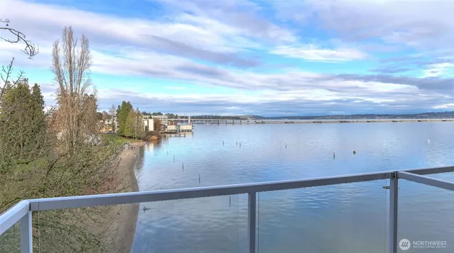 a view of a balcony with chair and potted plant