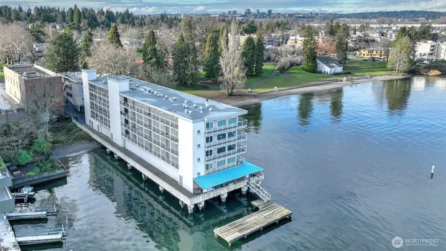 a view of a balcony with lake view and wooden floor