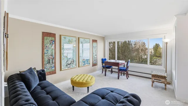 a view of a livingroom with furniture and a work table