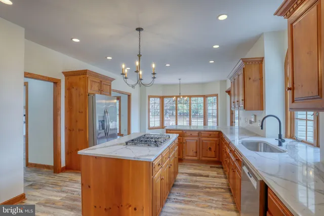 a view of an empty room with glass door and balcony