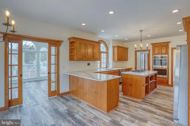 a view of a bedroom with furniture and a window