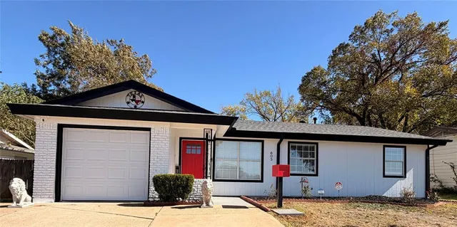 a front view of a house with yard