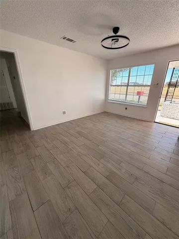 a view of an empty room with a window