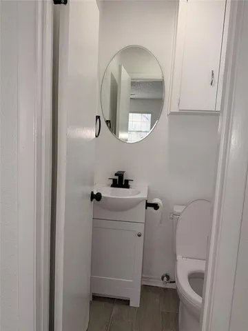a bathroom with a sink and mirror