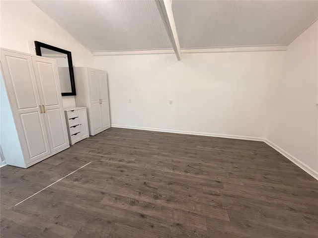 a view of a storage & utility room with cabinets
