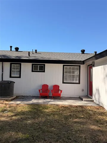 a view of a big room with table and chairs