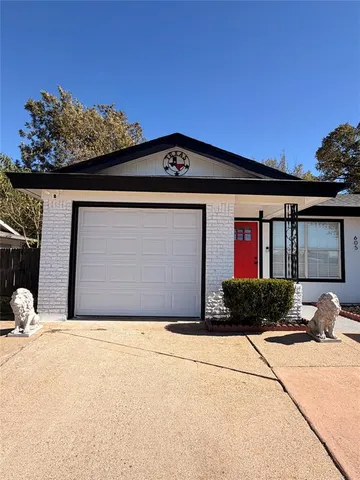 a front view of a house with a garage