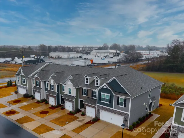 an aerial view of a house with a ocean view