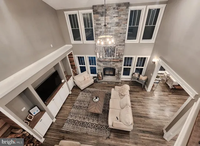a view of living room with furniture and fireplace