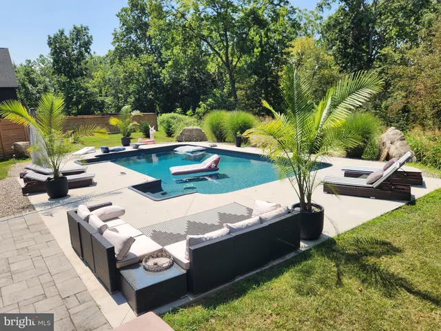 a view of a backyard with chairs