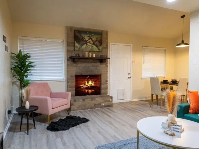 a kitchen with granite countertop a sink stainless steel appliances and cabinets