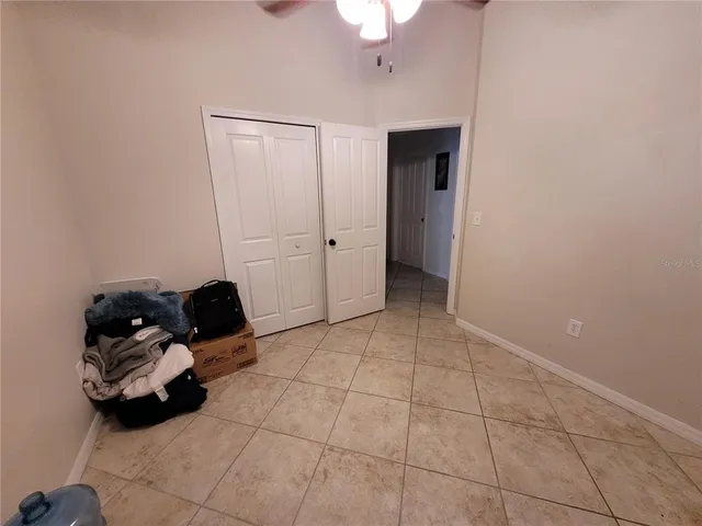 a bedroom with furniture and a chandelier