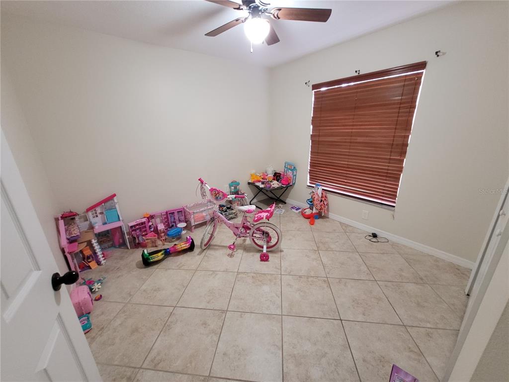4233 Amber Ridge Lane Valrico, FL 33594 - Photo 16 of 40 a room with toys and white walls