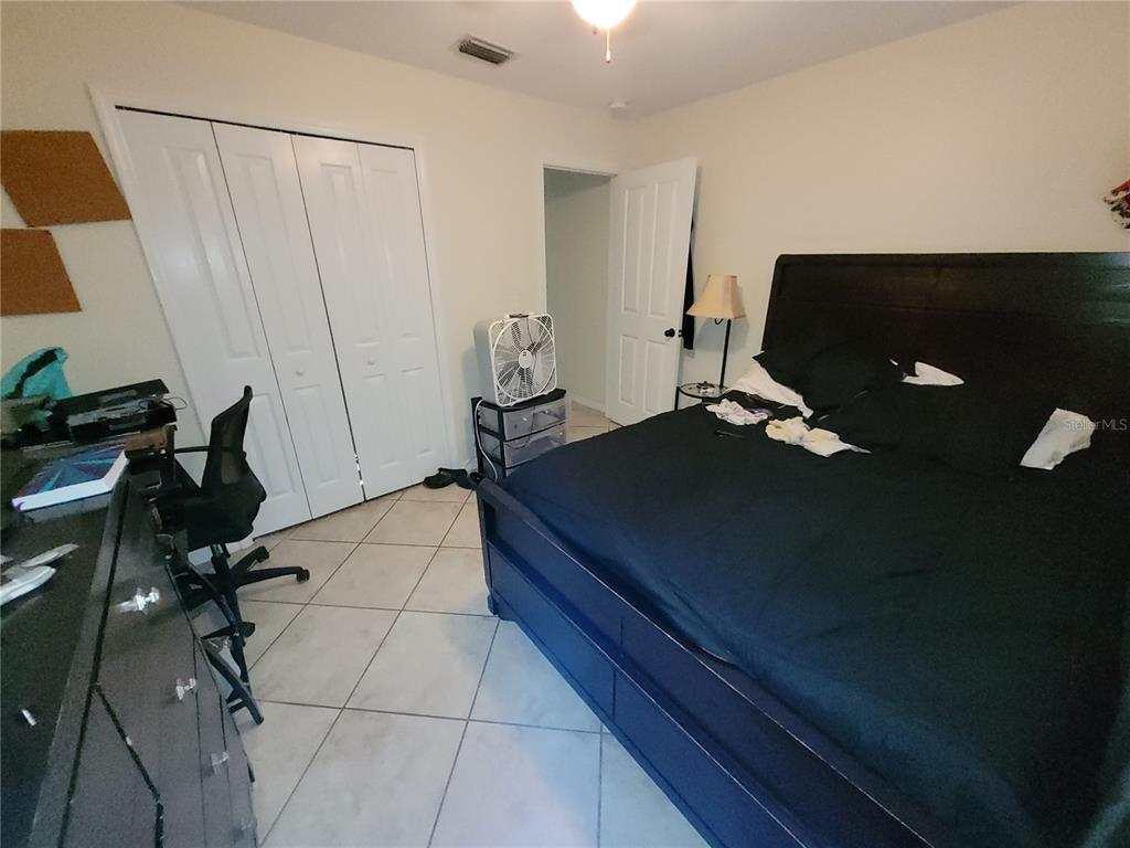 4233 Amber Ridge Lane Valrico, FL 33594 - Photo 19 of 40 a bed sitting in a room next to a window