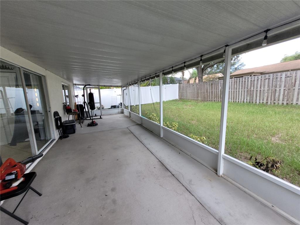 4233 Amber Ridge Lane Valrico, FL 33594 - Photo 35 of 40 a view of a garage with wooden floor