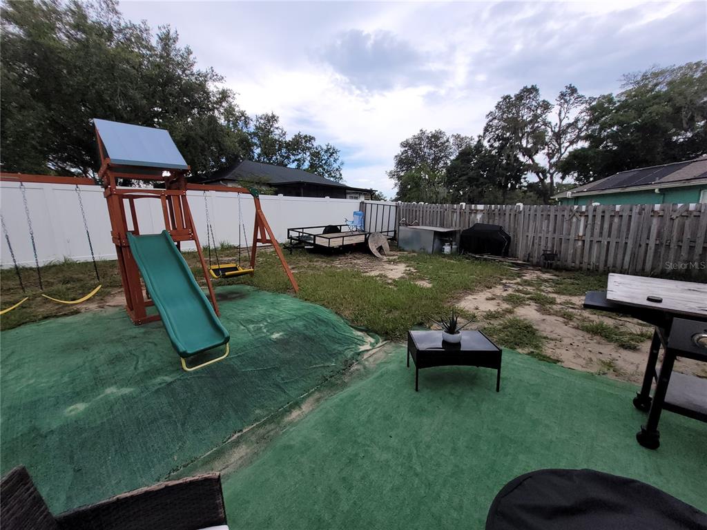 4233 Amber Ridge Lane Valrico, FL 33594 - Photo 36 of 40 a backyard of a house with seating space