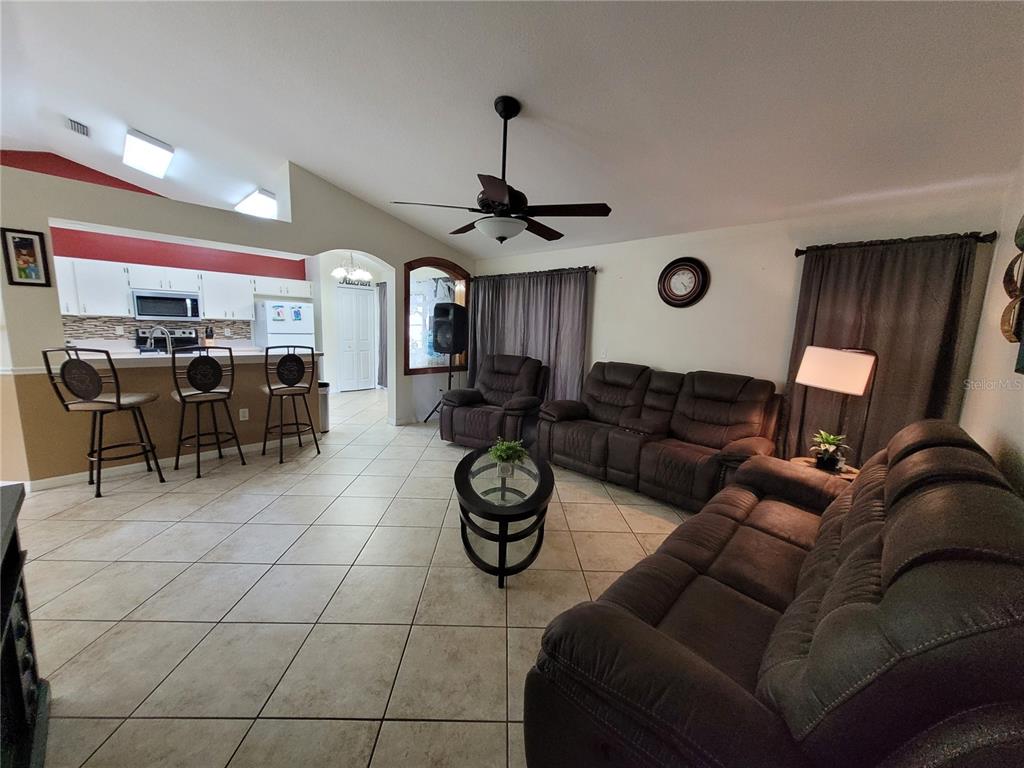 4233 Amber Ridge Lane Valrico, FL 33594 - Photo 10 of 40 a living room with patio furniture and a window