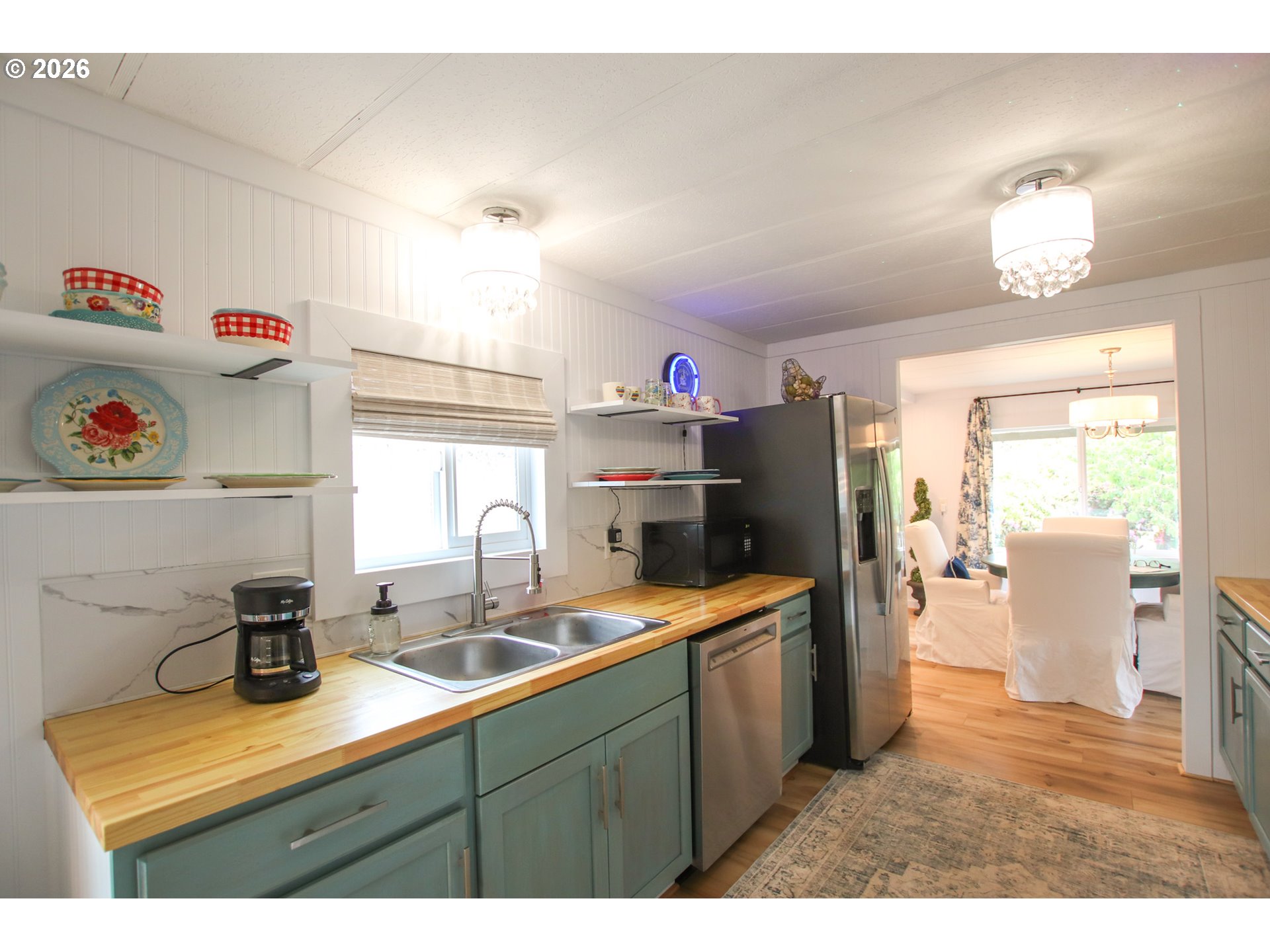 1431 Maple Street Florence, OR 97439 - Photo 14 of 43 a kitchen with cabinets a sink and appliances
