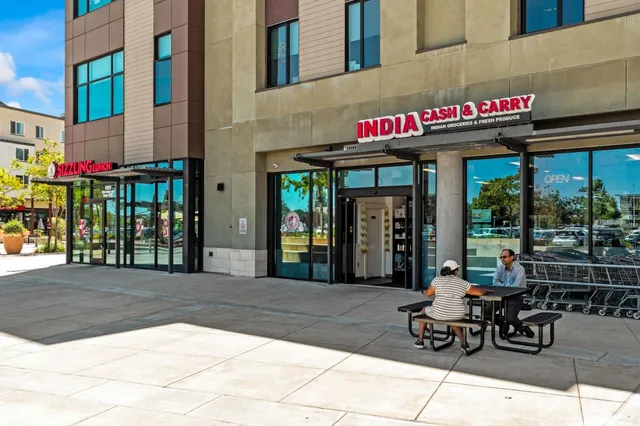 a view of a cafe with a table and chairs in patio